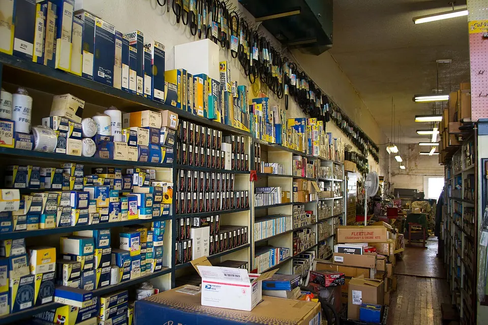 Shelves of boxed automotive parts in a parts store.