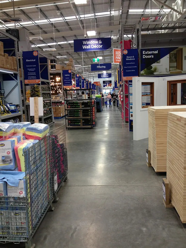 An aisle of building and hardware supplies in a store.