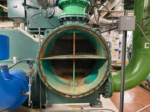 An opened industrial heat exchanger during maintenance.