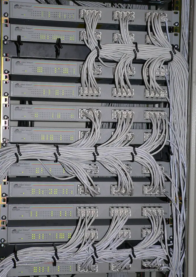 Network switches and patch cables in a rack.