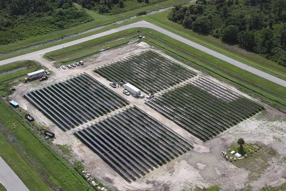 Rows of photovoltaic panels at a solar power installation.